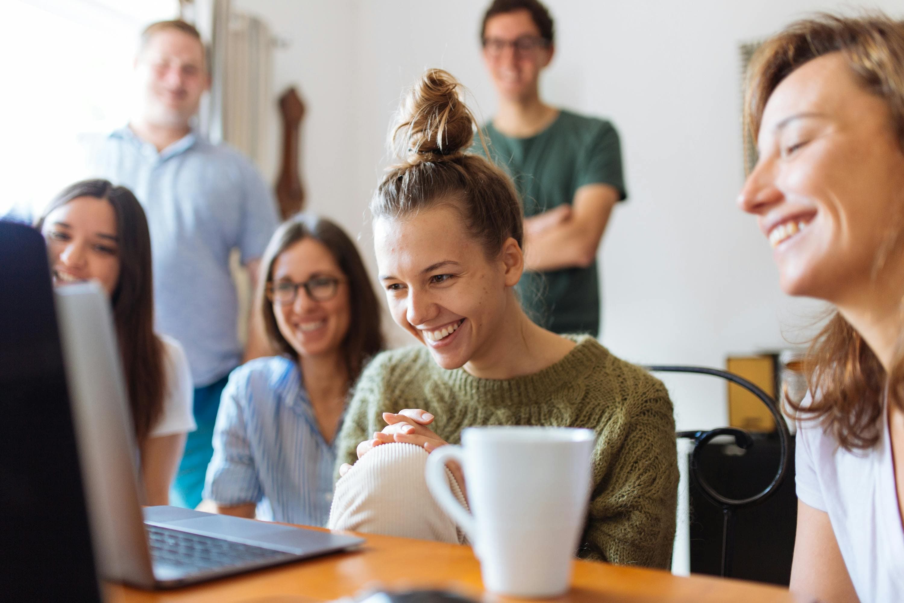 Satisfied customers looking at laptop